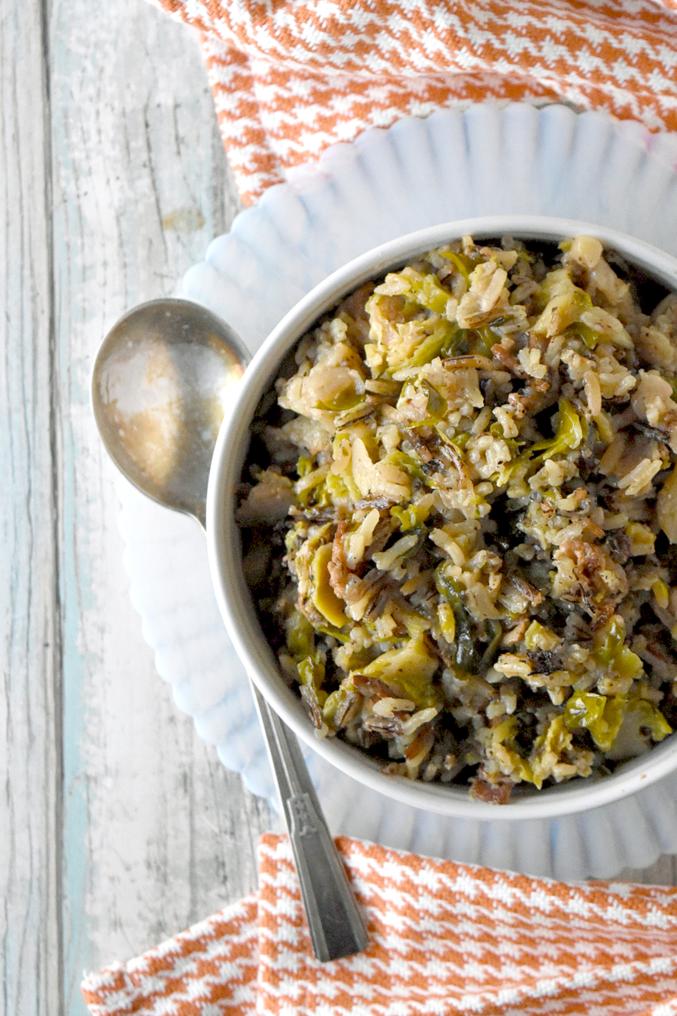 Wild Rice and Sprouts Pilaf is the perfect side dish to any holiday meal.  Any meal for that matter.  With long grain and wild rice simmered with Brussels sprouts and thick cut bacon, it’s a side dish you’re family will love! #HolidaySideDishes