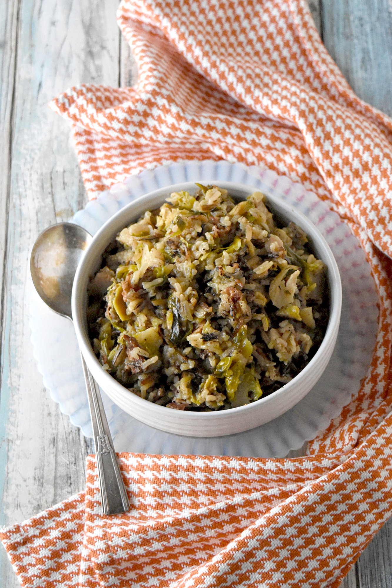 Wild Rice and Sprouts Pilaf is the perfect side dish to any holiday meal.  Any meal for that matter.  With long grain and wild rice simmered with Brussels sprouts and thick cut bacon, it’s a side dish you’re family will love! #HolidaySideDishes
