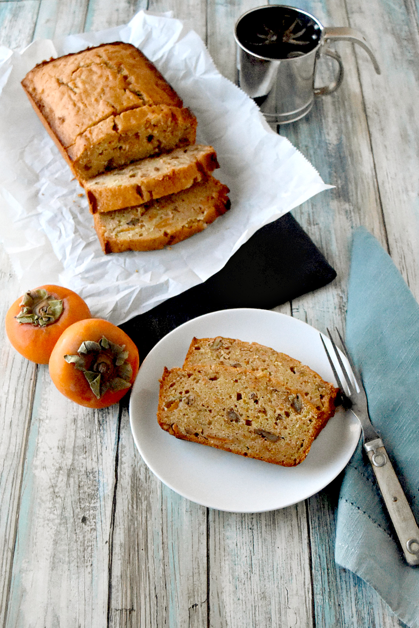 Bourbon Pecan Persimmon Bread has a hint of bourbon and persimmon packed with crunchy pecans. It’s moist, delicious, and packed full of deliciously ripe persimmons. #FamilyBakingChallenge #OurFamilyTable