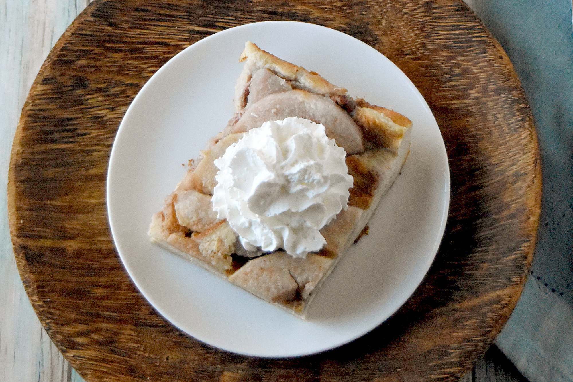 Butterscotch Pear Bread Pudding is rich with custard and bread topped with Butterscotch pears and caramel sauce.  It’s the perfect dessert to get you through winter. #FamilyBakingChallenge