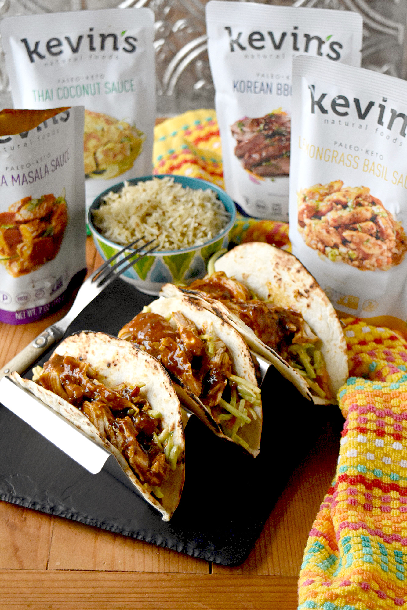 Chicken Tikka Masala Tacos taste amazing for a meal made in under 30 minutes. The chicken simmers in delicious tikka masala sauce and the slaw has extra crunch from the broccoli and peanuts.  #eatcleanlivehappy #kevinsnaturalfoods #kevinsrecipechallenge