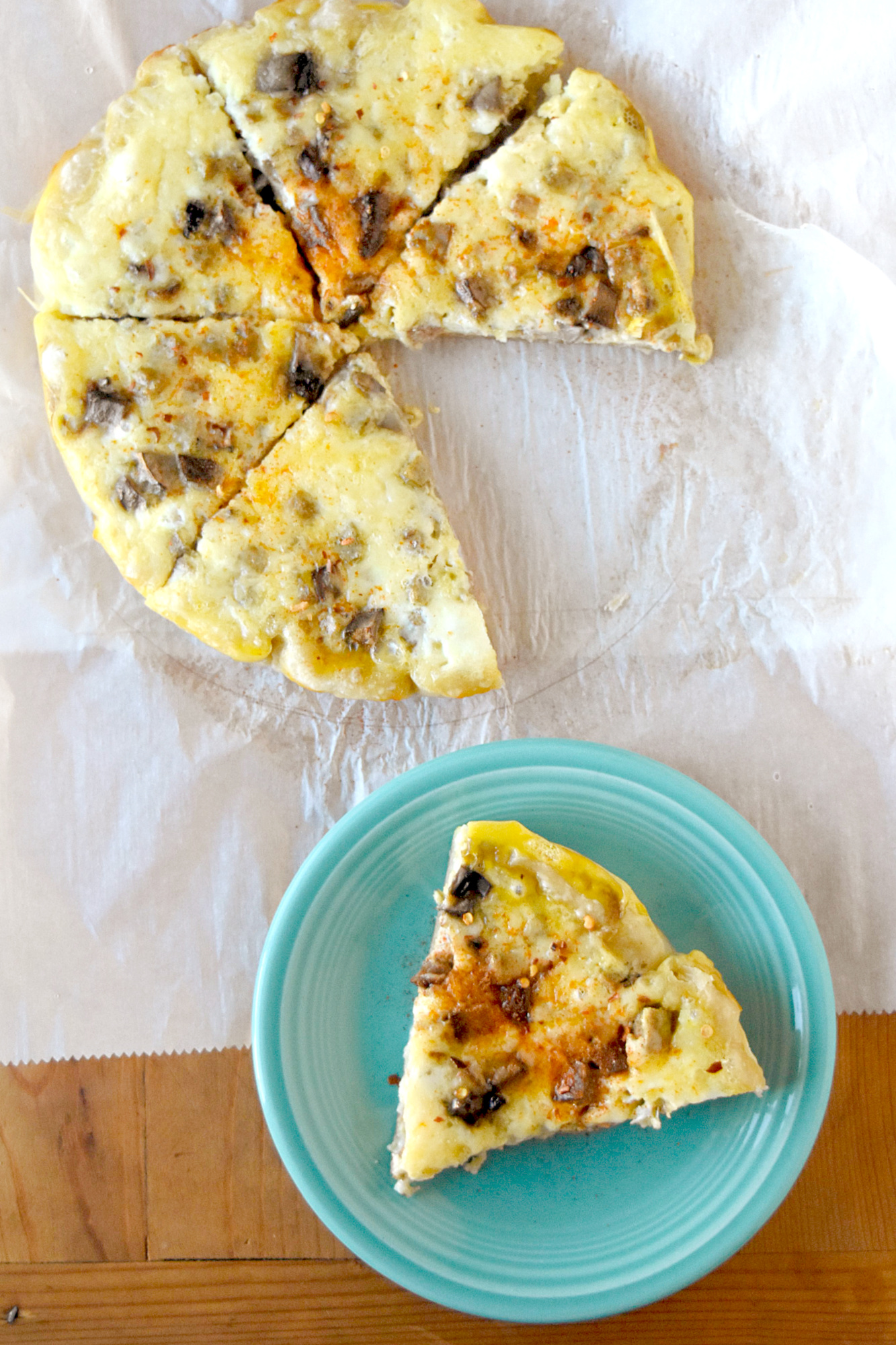 Simple Slow Cooker Breakfast Pizza is a recipe that you can toss in the slow cooker and feed the hungry masses. It’s topped with sausage and mushrooms, but you can add whatever toppings you wish! #NationSlowCookerMonth