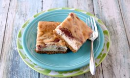 Rhubarb Cheesecake Bars are full of sweet tart flavor.  They are creamy and perfectly delicious. #SpringSweetsWeek