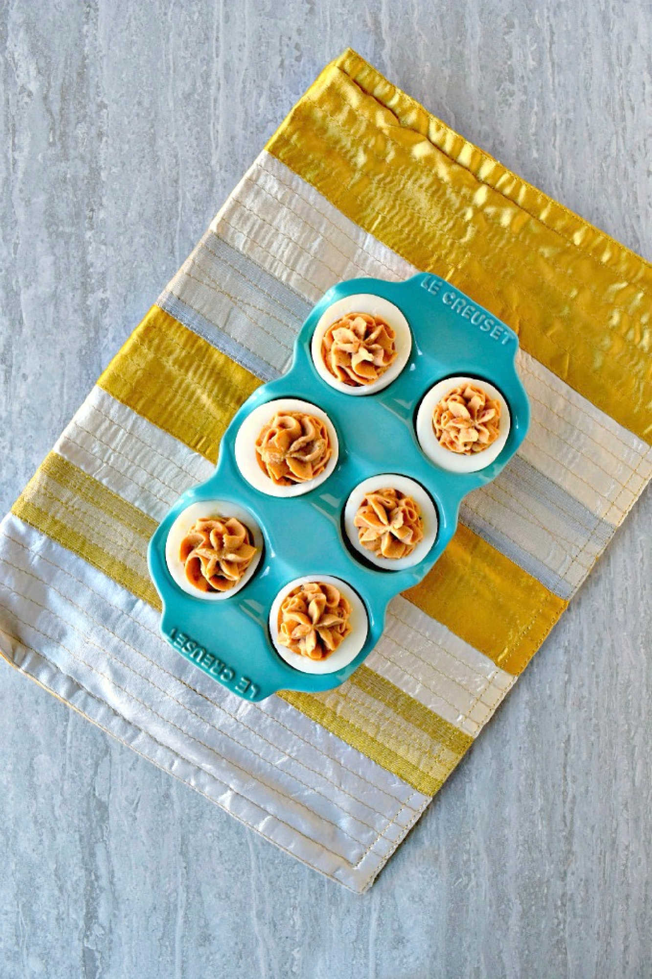 Spice up your feed (and your party menu!) with this flavorful twist on a classic: Middle Eastern Deviled Eggs! Made with 2 kinds of creamy hummus and roasted red peppers, then added a punch of za'atar and sumac for a zesty, savory kick that’s seriously addictive. #deviledeggs #hummus #Easter #MiddleEasternEats #DeviledEggPerfection #SavorySnacks #EggcellentRecipes #FlavorsofTheLevant