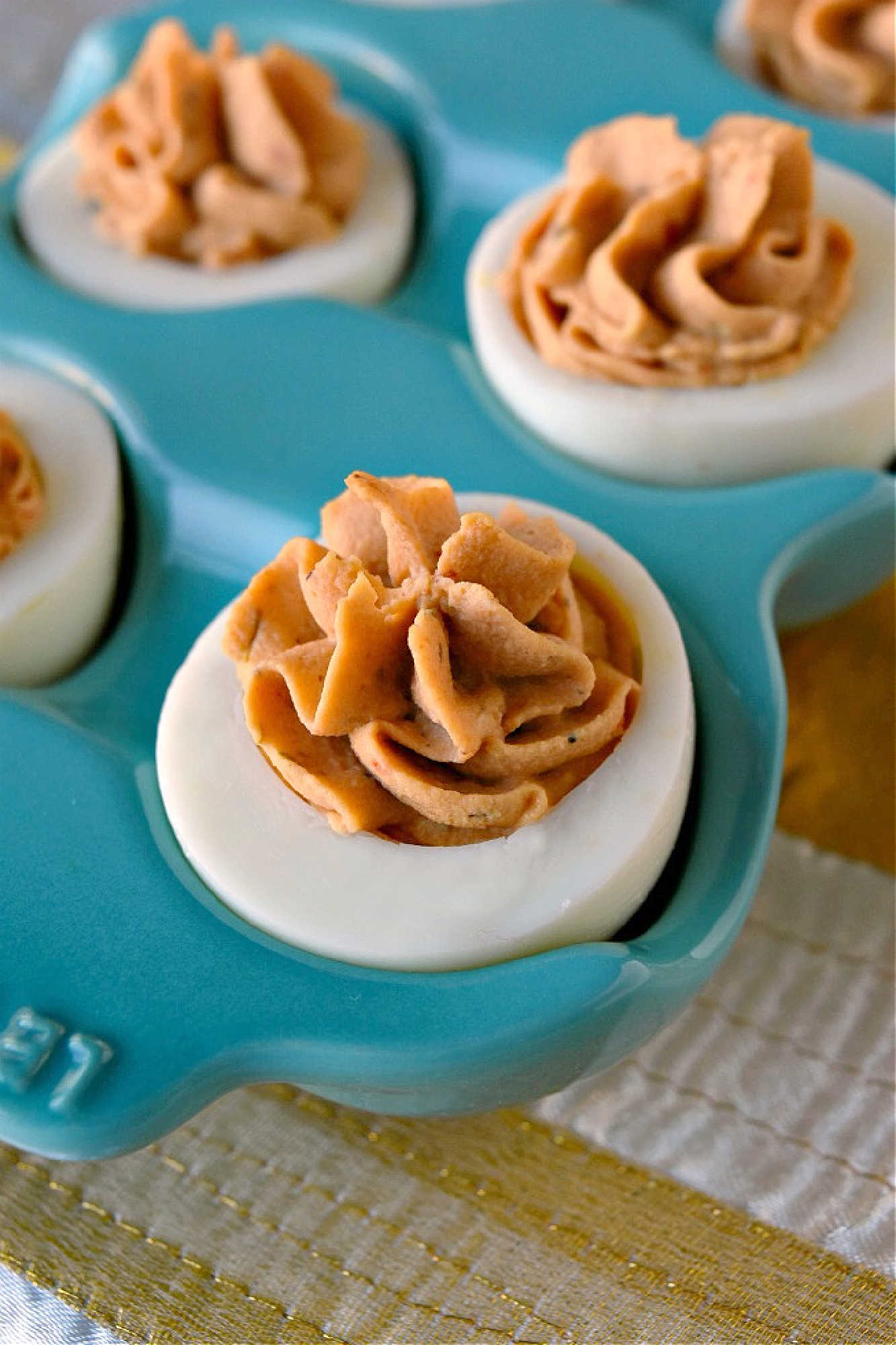 Spice up your feed (and your party menu!) with this flavorful twist on a classic: Middle Eastern Deviled Eggs! Made with 2 kinds of creamy hummus and roasted red peppers, then added a punch of za'atar and sumac for a zesty, savory kick that’s seriously addictive. #deviledeggs #hummus #Easter #MiddleEasternEats #DeviledEggPerfection #SavorySnacks #EggcellentRecipes #FlavorsofTheLevant