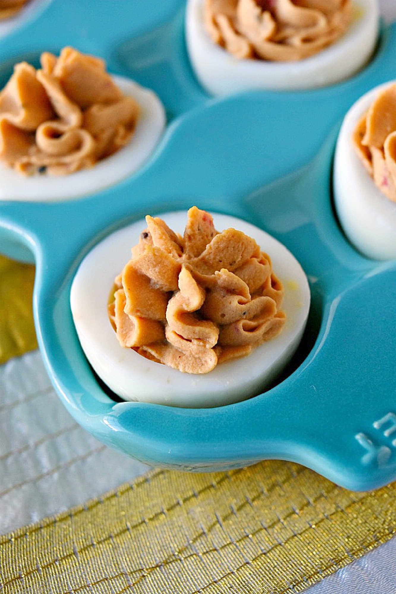 Spice up your feed (and your party menu!) with this flavorful twist on a classic: Middle Eastern Deviled Eggs! Made with 2 kinds of creamy hummus and roasted red peppers, then added a punch of za'atar and sumac for a zesty, savory kick that’s seriously addictive. #deviledeggs #hummus #Easter #MiddleEasternEats #DeviledEggPerfection #SavorySnacks #EggcellentRecipes #FlavorsofTheLevant