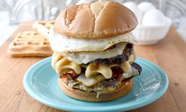 Double Decker Brunch Burger is just that. Brunch on a bun. It starts with two smashed patties topped with cheese. The top layer has a fried egg and bacon and there’s a waffle in the middle making it an epic double decker burger. #BurgerMonth