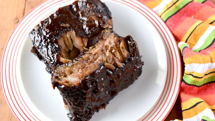 Easy Smoked Ribs are tender, delicious, and mostly hands off.  Even if you don't have a smoker you can still have delicious ribs for your barbecue. #BBQWeek #smokedribs #stickyribs #bestribs #easysmokedribs