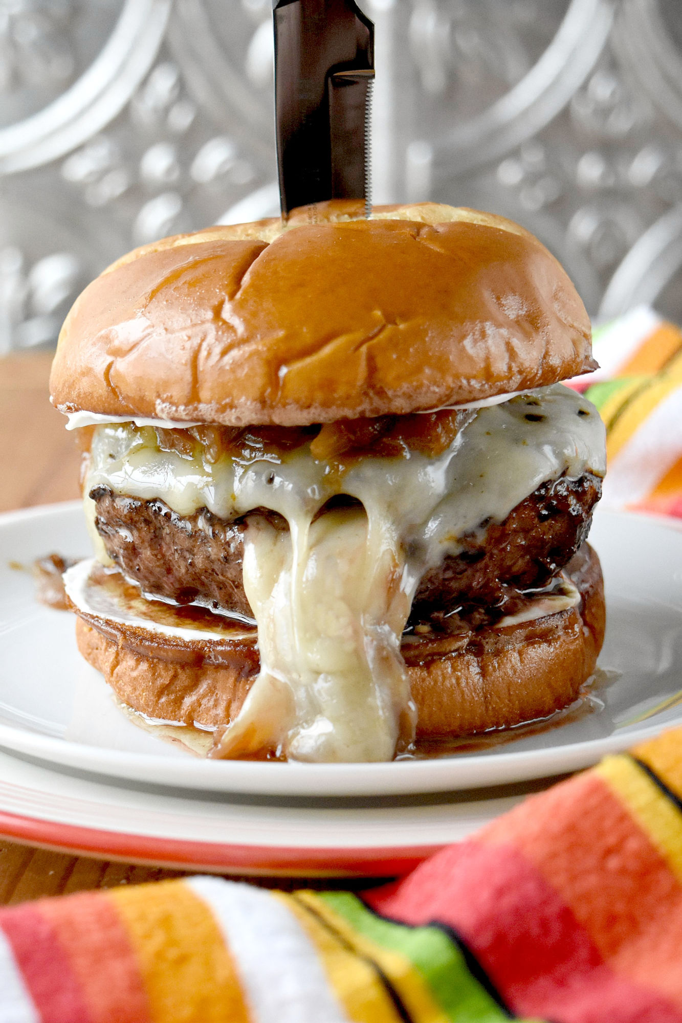 The caramelized onions make this French Onion Soup Burger over the top.  It's a labor of love but makes for one killer burger. #BurgerMonth