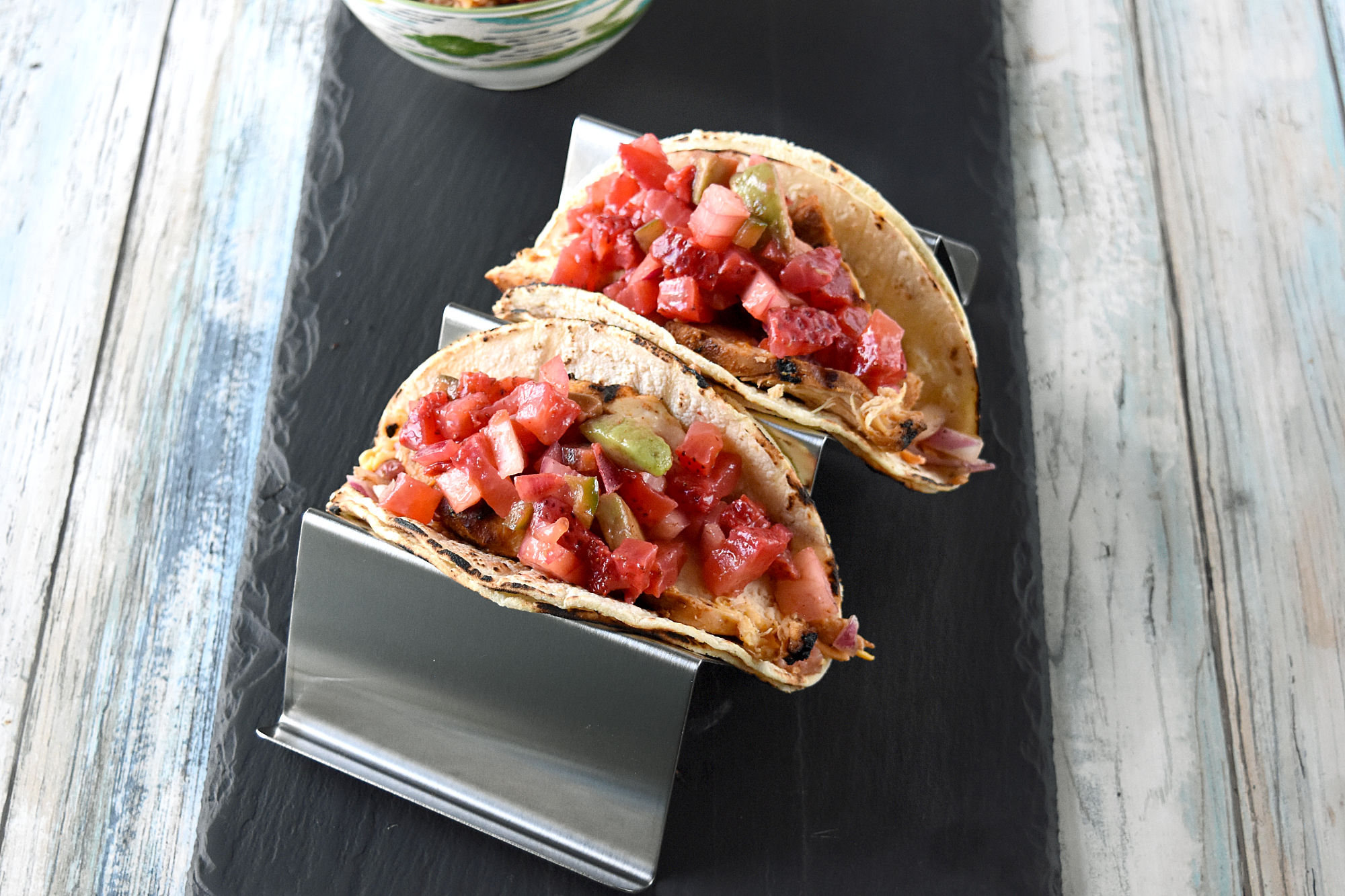 Grilled Chicken Tacos with Strawberry Salsa have a sweet and spicy kick you will love. The strawberries replace the tomatoes in the salsa and fits perfect with the onions, jalapeno, and creamy avocado. #FarmersMarketWeek