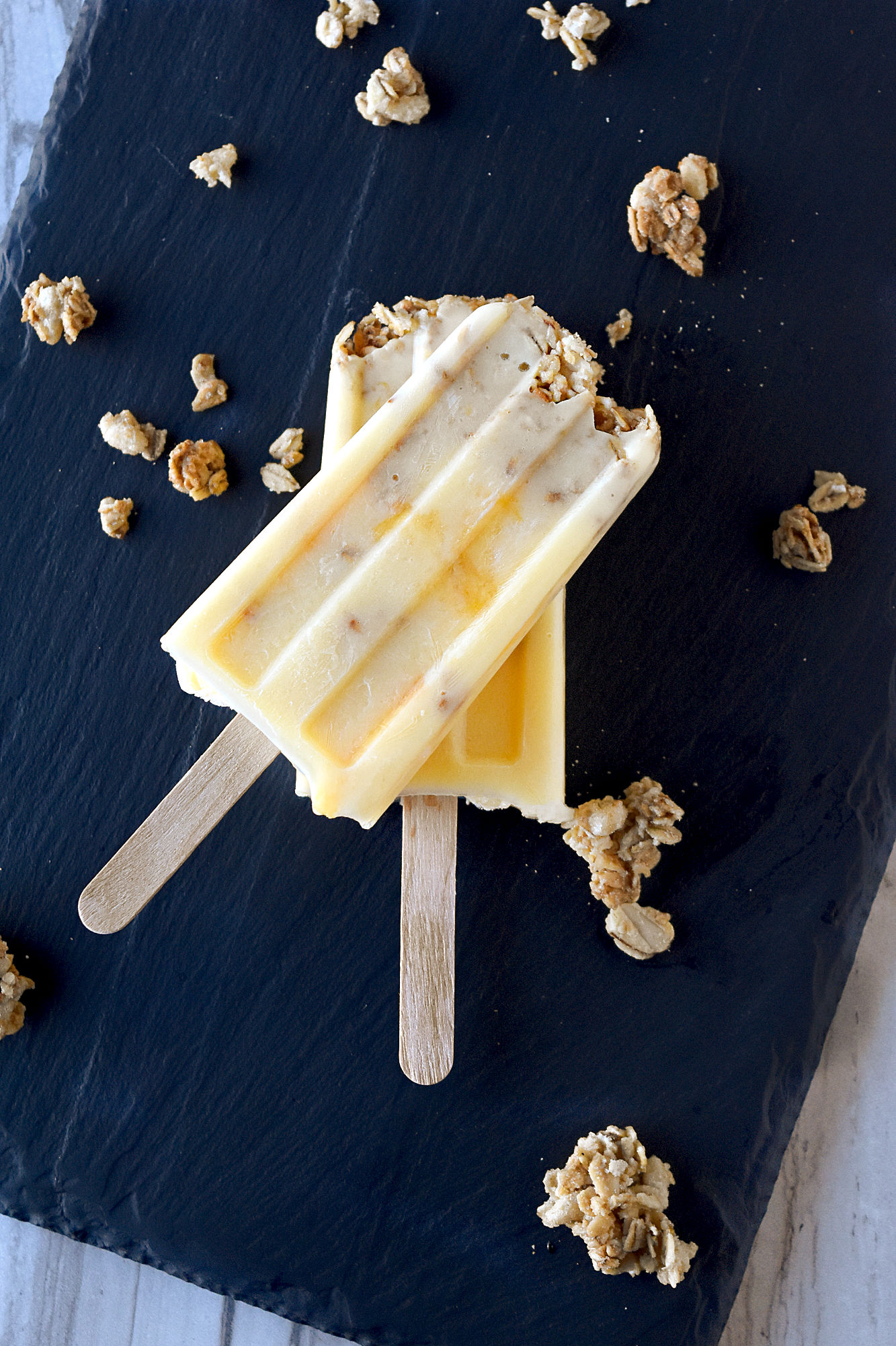 Peach Crisp Popsicles have delicious summer flavor in an easy to whip up frozen dessert. The granola adds the texture of a crisp without heating up the kitchen. #FarmersMarketWeek