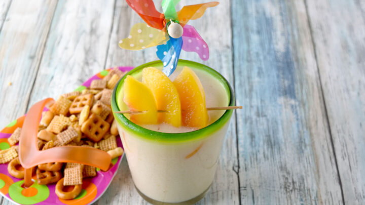 Peachy Colada has simple ingredients and tastes perfectly delicious.  Made with frozen peaches, 2 types of rum, and crema of coconut, it's a refreshing summer colada you'll enjoy. #OurFamilyTable
