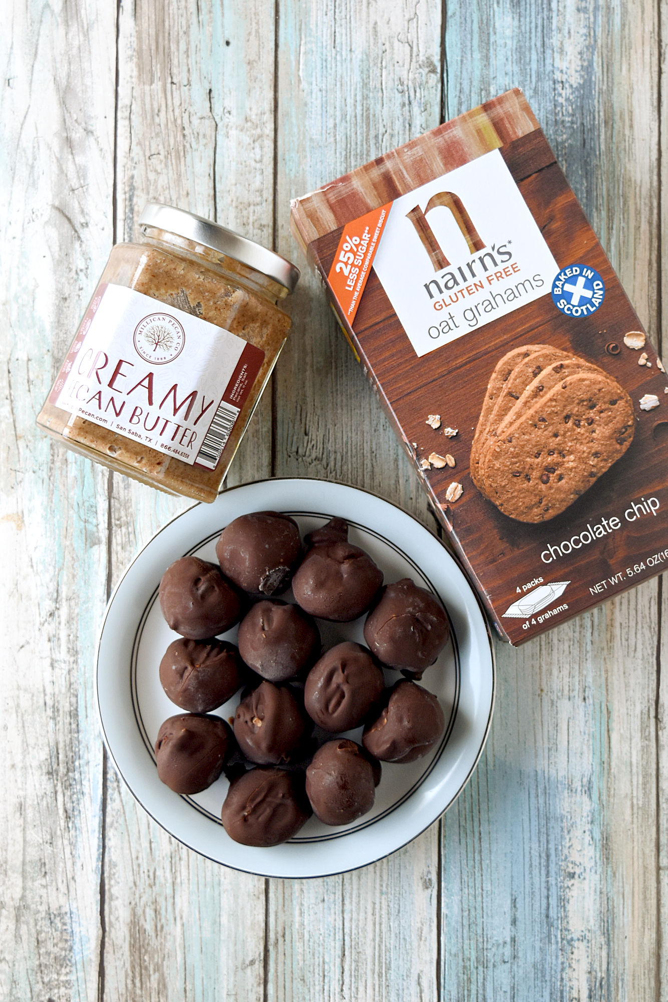Chocolate Chip Pecan Truffles are healthy cookie truffles! Made with Nairn’s chocolate chip grams and Millican Pecan’s scrumptious pecan butter, these truffles are guilt free and wholesome. #FallFlavors