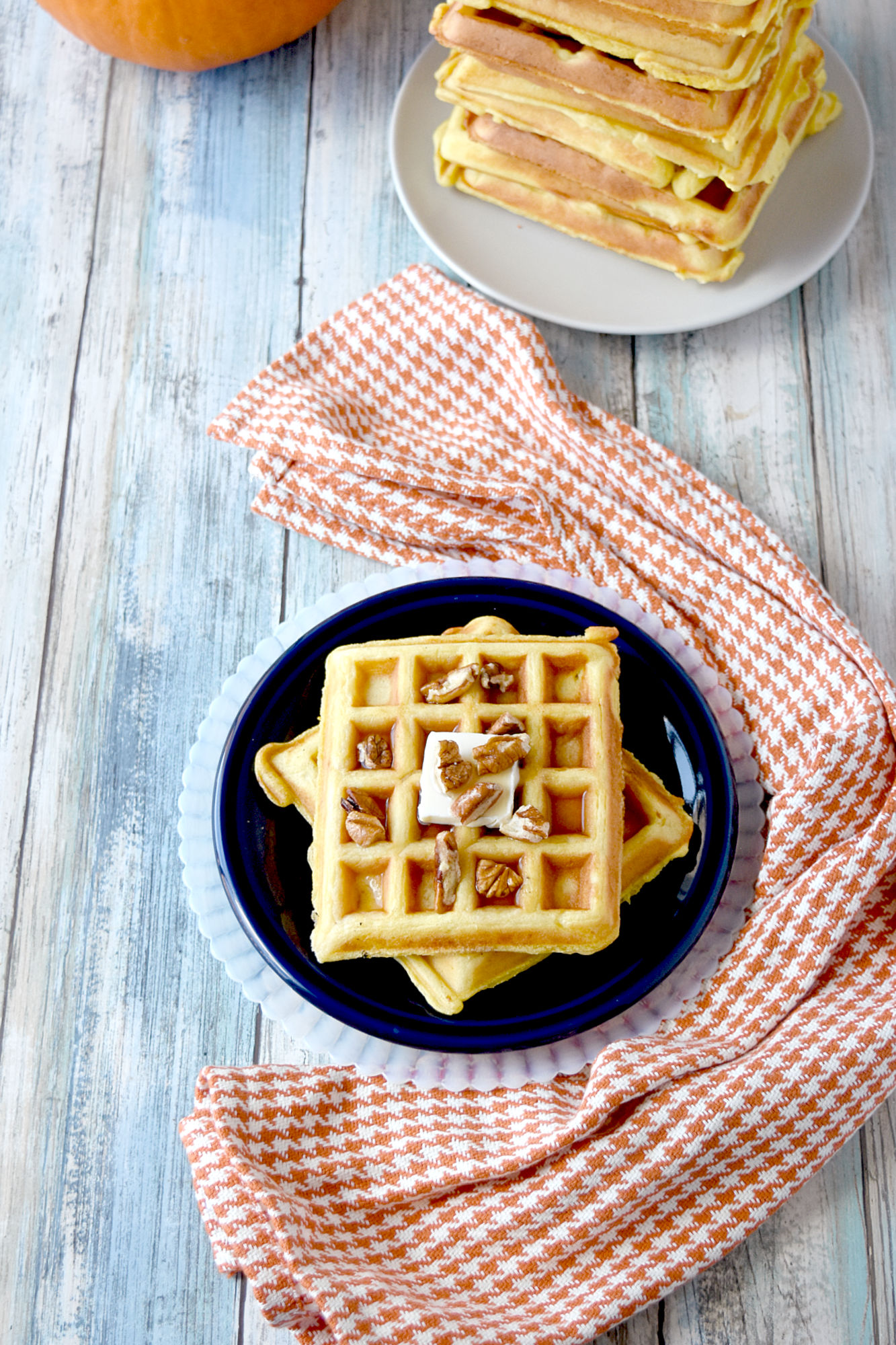Overnight Pumpkin Waffles are light, fluffy, and irresistible.  Your family will love them and ask for them all the time.  You will love how easy they are to make. #PumpkinWeek
