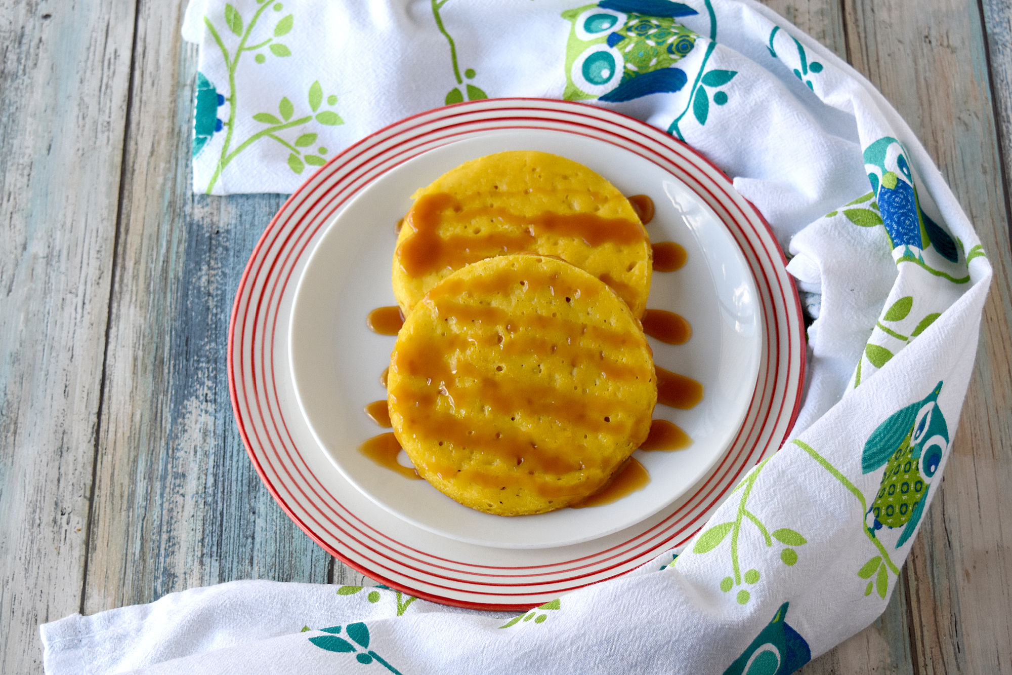 Serabi Labu Kuning aka Yellow Pumpkin Crumpets are slightly sweet and very delicious.  They're sort of like a crumpet but without the chewy texture.  These are perfect topped with caramel sauce for dessert. #PumpkinWeek