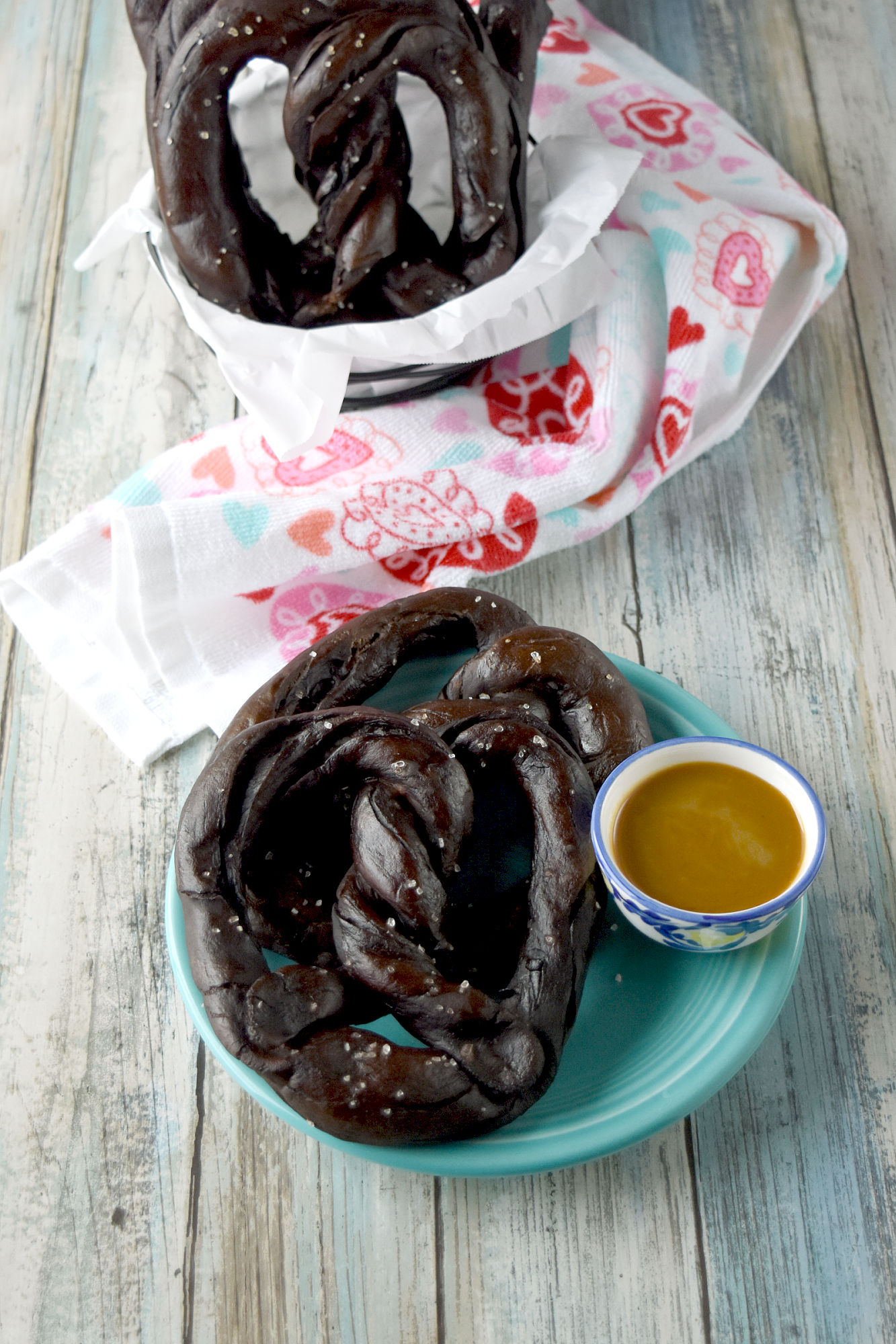 Easy Soft Chocolate Pretzels are chewy and delicious with the aroma and flavor of chocolate.  These are savory pretzels and taste delicious with a buckwheat honey mustard dipping sauce. #ChocolateWeek 