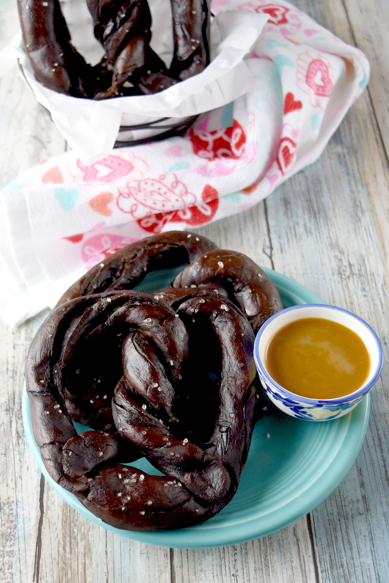 Easy Soft Chocolate Pretzels are chewy and delicious with the aroma and flavor of chocolate.  These are savory pretzels and taste delicious with a buckwheat honey mustard dipping sauce. #appetizer #softpretzel #homemadepretzel #NewYearsEve