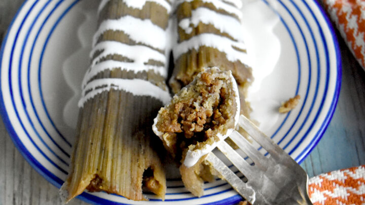 Simple Ground Beef Tamales have simple ingredients but taste so delicious!  Making the filling and the masa is simple. The hardest part is filling and stuffing the tamales. But that’s the fun part, too! #OurFamilyTable