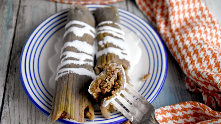 Simple Ground Beef Tamales have simple ingredients but taste so delicious!  Making the filling and the masa is simple. The hardest part is filling and stuffing the tamales. But that’s the fun part, too! #OurFamilyTable