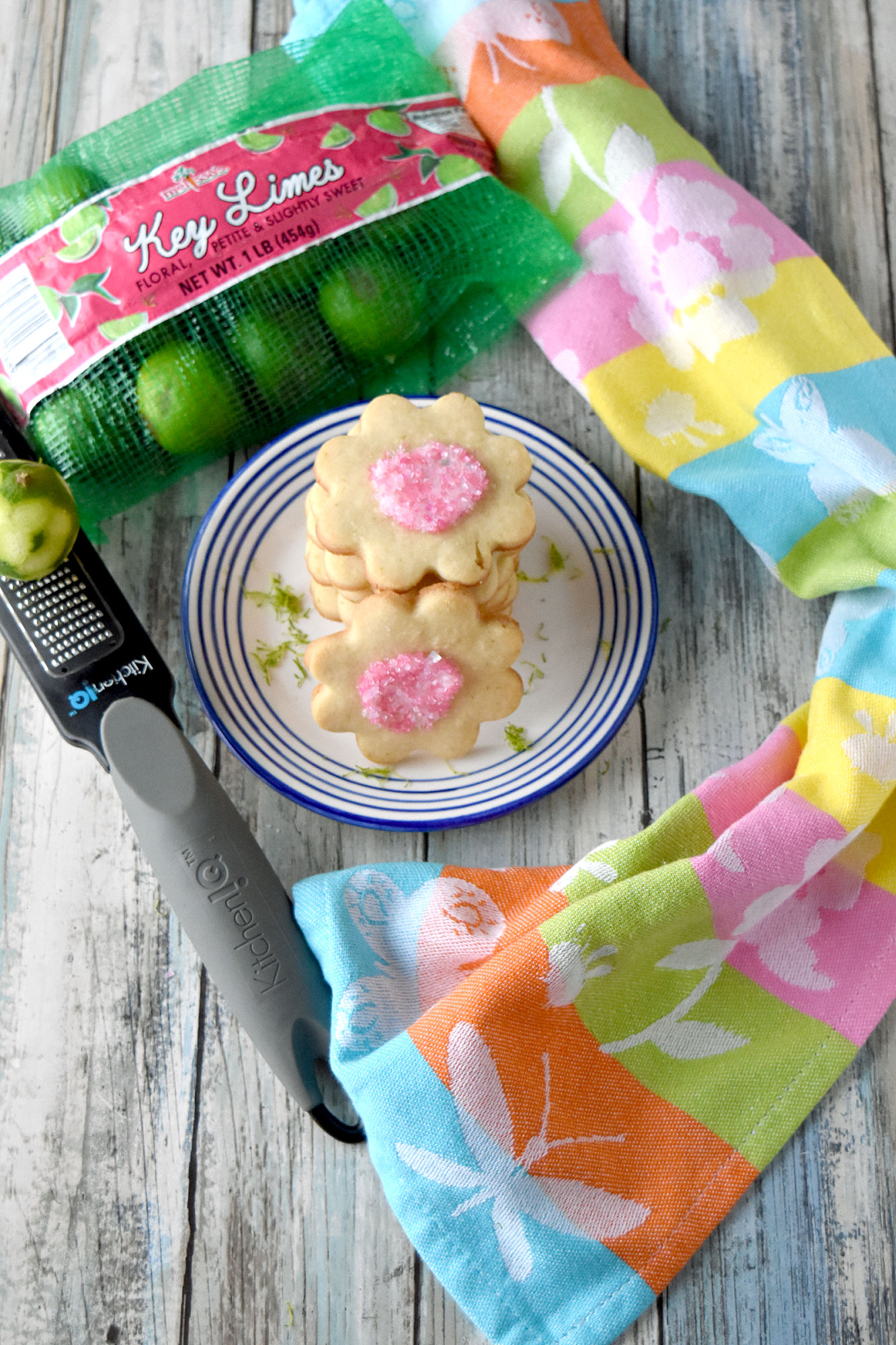 Key Lime Shortbread Cookies are buttery, light, and have a hint of key lime flavor. This dough is simple and quick to whip up in a food processor so you can make these cookies any time you want! #SpringSweetsWeek #cookie #keylime #shortbread