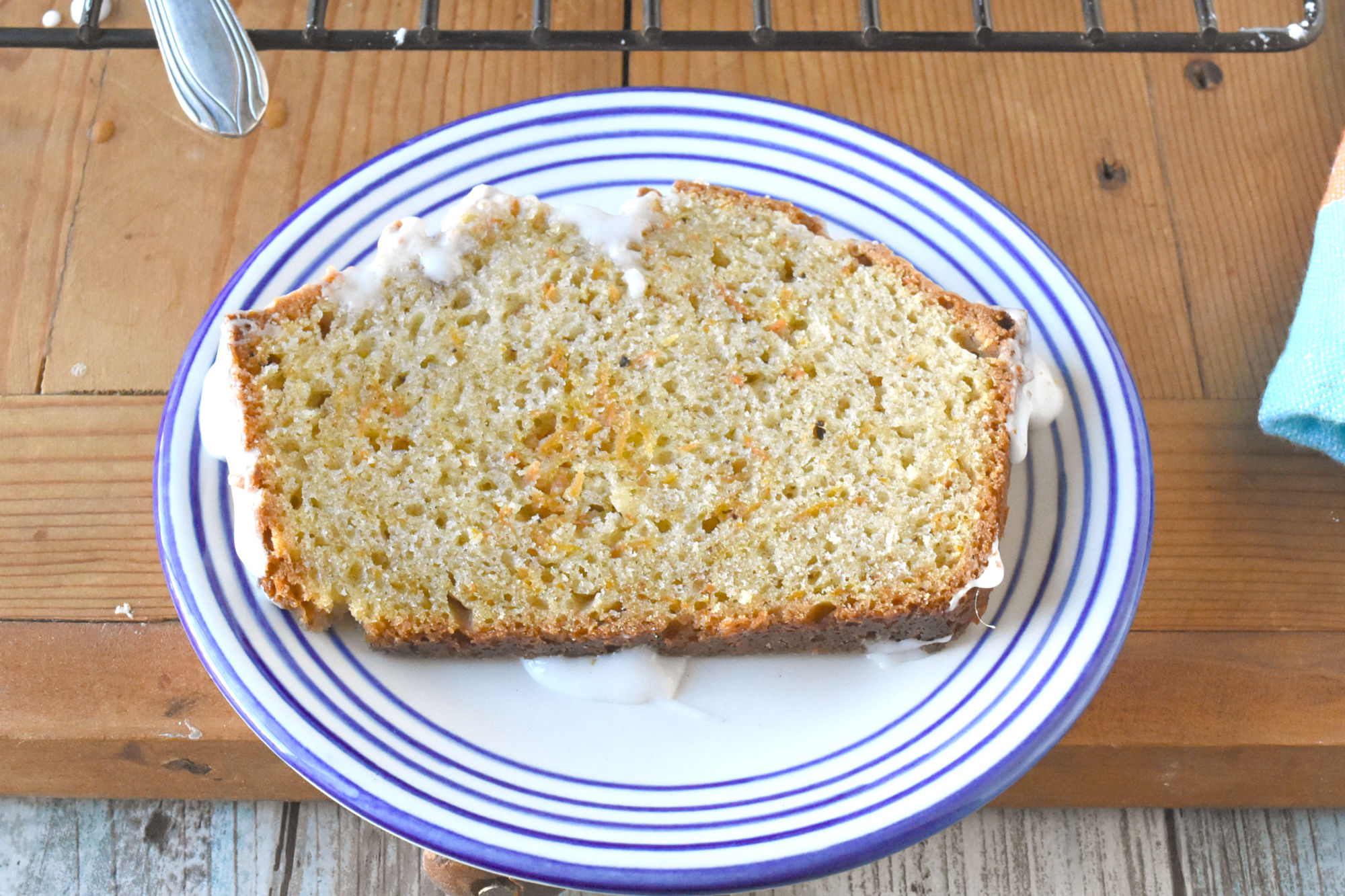 Carrot Cake Loaf has all the flavors of carrot cake in a quick bread loaf. It’s moist, full of spices, and super easy to make. #OurFamilyTable