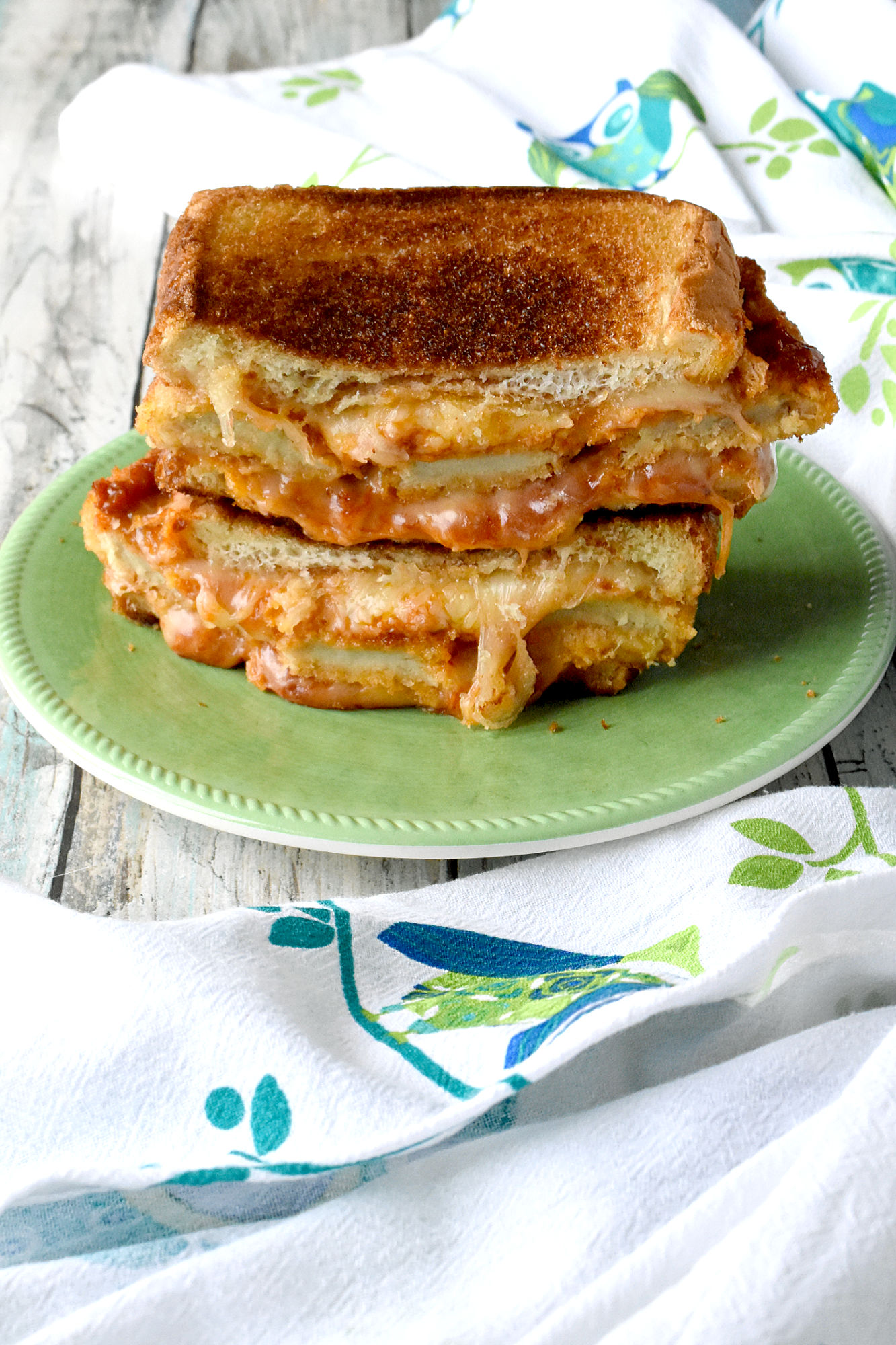 Chicken Parm Grilled Cheese is packed with chicken, cheese, and sauce. Made with thick Texas toast, premade chicken strips and sauce, it’s a simple and simply hearty grilled cheese for lunch or dinner. #OurFamilyTable