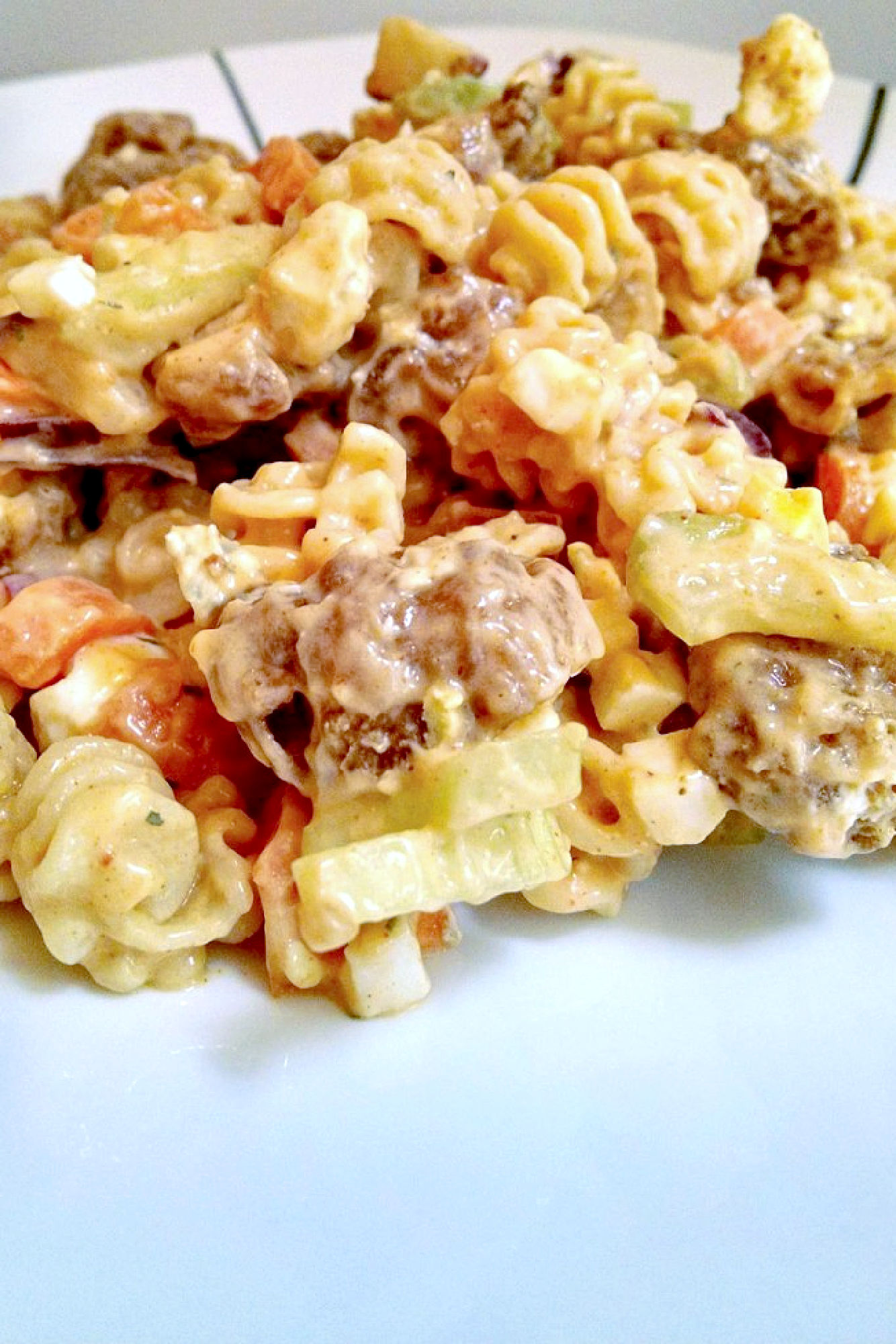 Buffalo Chicken Pasta Salad uses leftover boneless buffalo chicken wings to make a deliciously quick and spicy weeknight dinner, but you could use any boneless and skinless chicken you have available. #BuffaloChickenPastaSalad #PastaSaladPerfection #SpicySaladSensation #SummerEats #EasyPastaRecipes #pastasalad #rotisseriechicken #Buffalochicken #TailgateFavorites #SpicyPastaSalad #PastaSaladObsessed