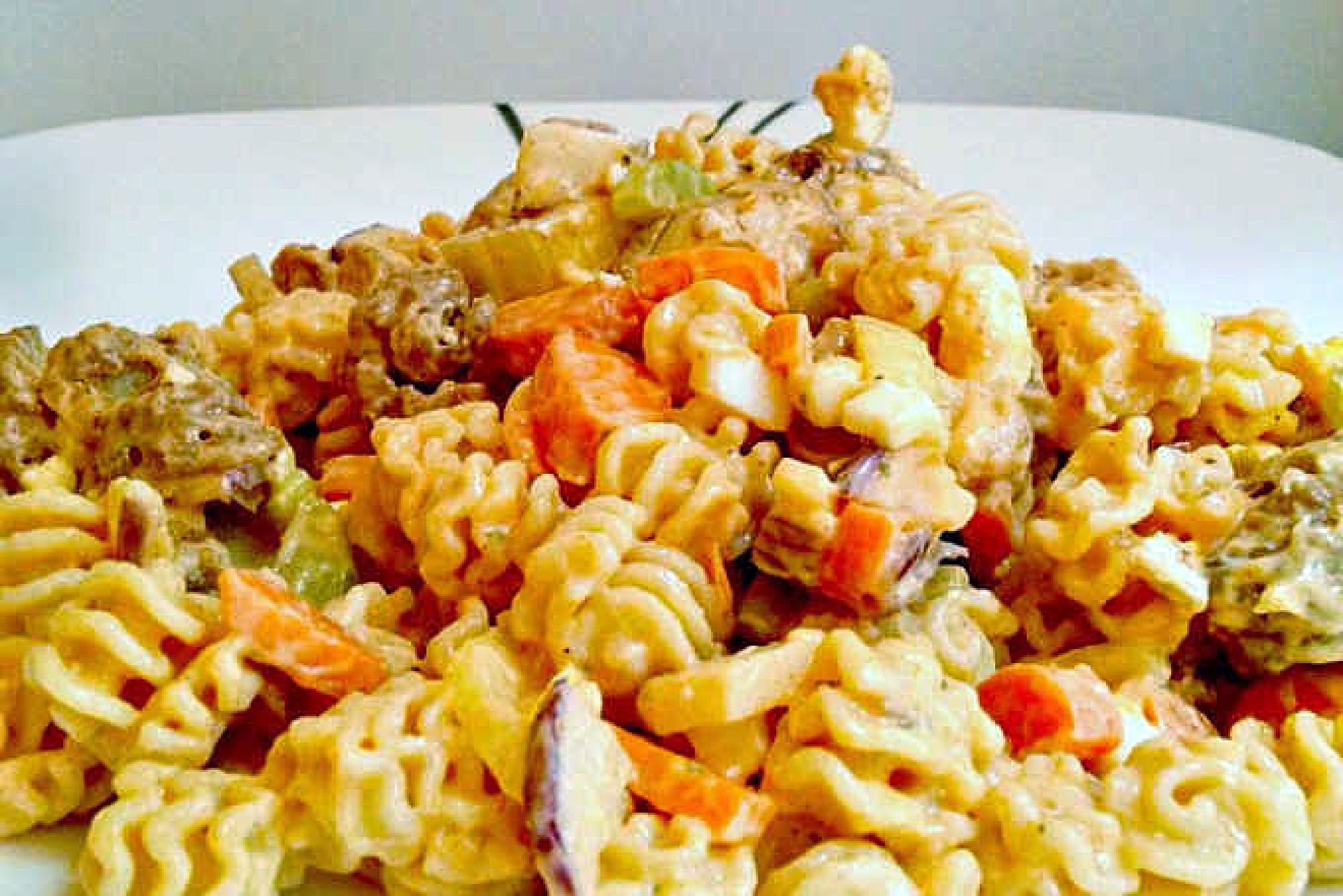 Buffalo Chicken Pasta Salad uses leftover boneless buffalo chicken wings to make a deliciously quick and spicy weeknight dinner, but you could use any boneless and skinless chicken you have available. #BuffaloChickenPastaSalad #PastaSaladPerfection #SpicySaladSensation #SummerEats #EasyPastaRecipes #pastasalad #rotisseriechicken #Buffalochicken #TailgateFavorites #SpicyPastaSalad #PastaSaladObsessed