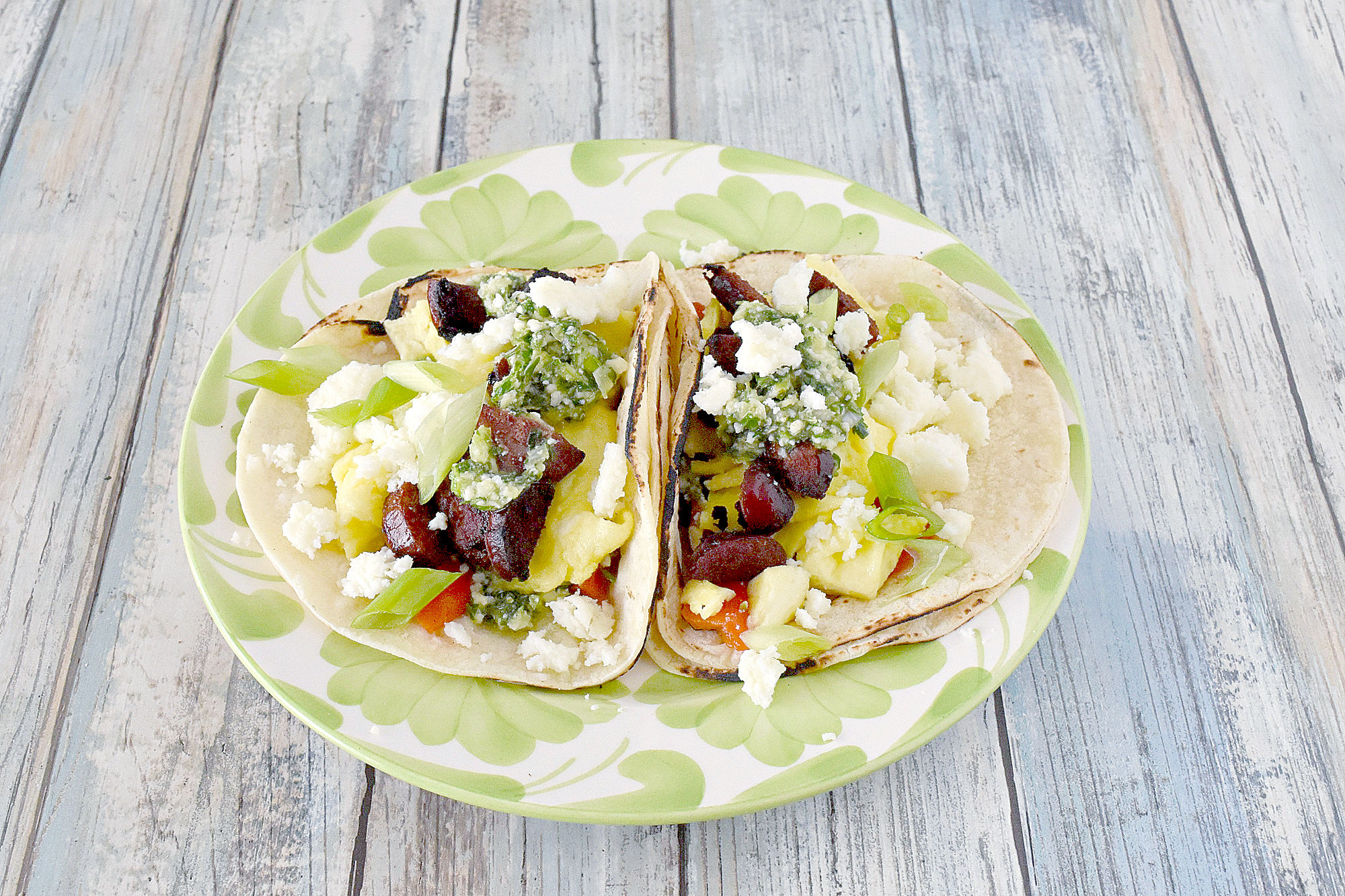 Chorizo and Egg Breakfast Tacos have such delicious flavor! From the slightly spicy chorizo to the fresh chimichurri these tacos have so much flavor. #OurFamilyTable