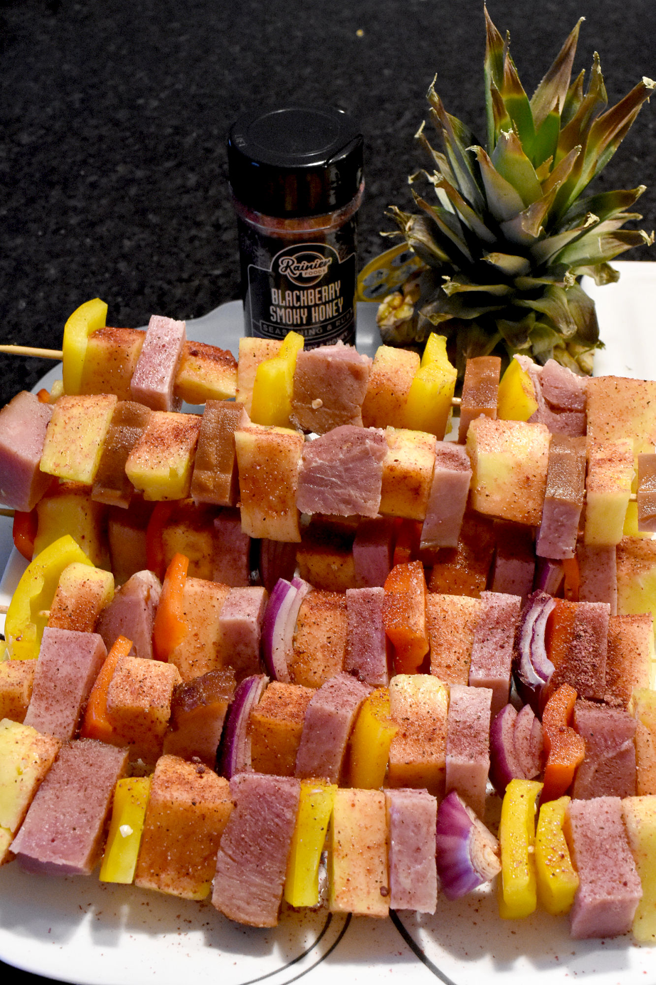 You can make Spicy Hawaiian Ham Kabobs with leftover ham, fresh pineapple, and some veggies. Sprinkle some Blackberry Smoky Honey seasoning for a sweet and spicy kick that makes these kabobs absolutely delicious. #BBQWeek