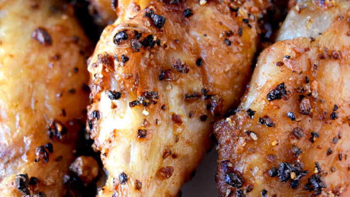 Crispy Air Fryer Chicken Wings are super crispy, delicious, and on your plate in under 25 minutes. I used a gochujang-based rub, but you can use your favorite rub for these simple wings. #OurFamilyTable #wings #airfryer #crispywings #gochujang