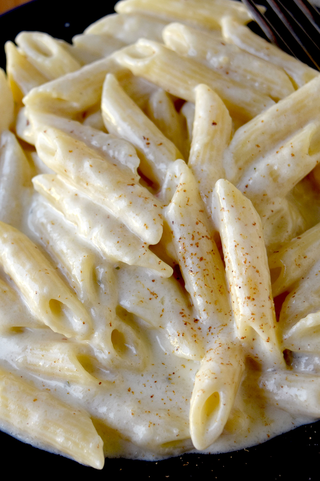Easy Alfredo Sauce has 3 ingredients. It’s easier and simpler than you think to make a restaurant quality Alfredo sauce that is lick the plate delicious. #DairyMonth #Alfredo