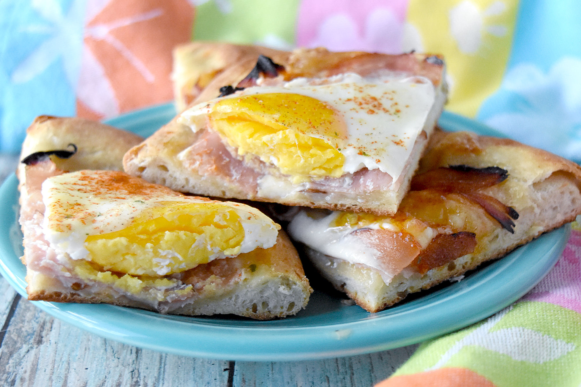Individual Breakfast Pizzas are easy to prep and even easier to let your guests create and bake their own! Make breakfast pizza bar and let them have fun making their own breakfast pizza.
