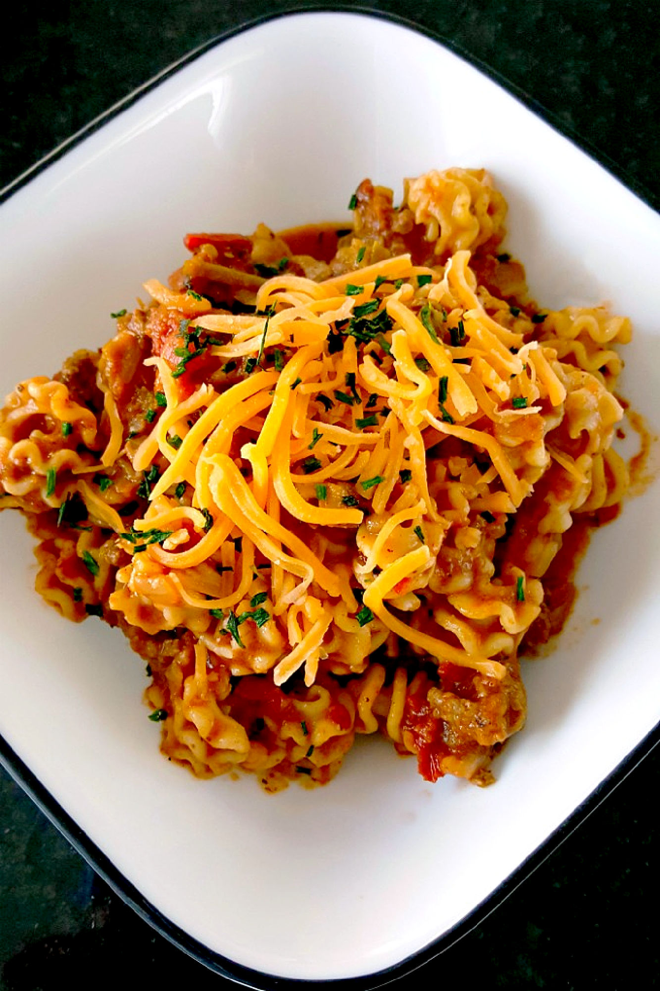 This is even better than my chili mac! This Skillet Taco Pasta cooks up in one pot, tastes like my favorite tacos, and comes together quickly for any night of the week. #OurFamilyTable #tacopasta #onepotrecipe