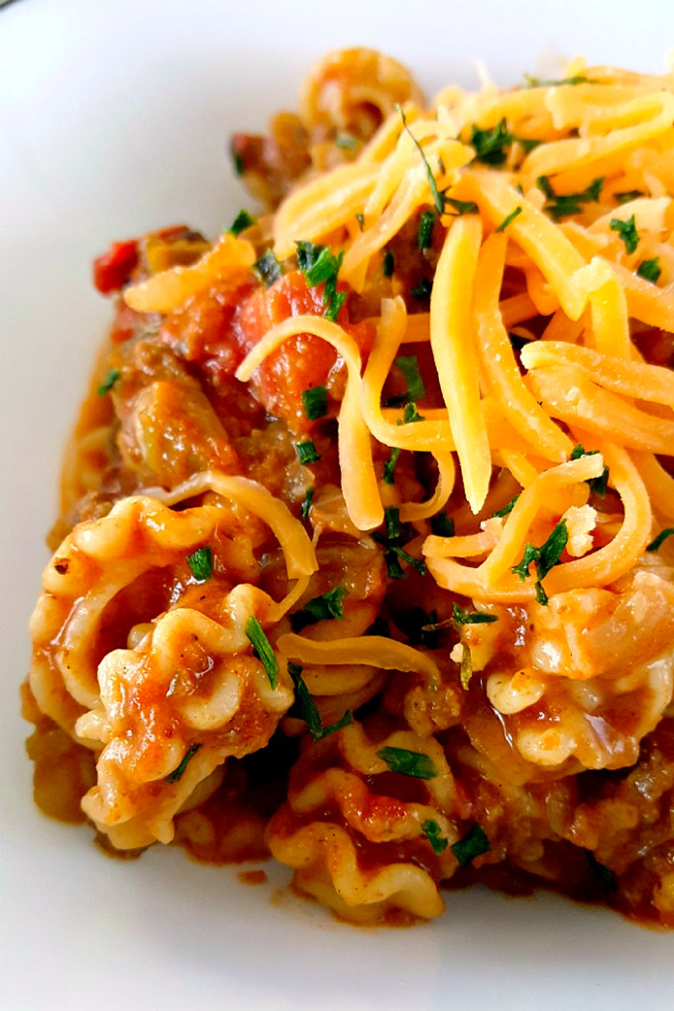 This is even better than my chili mac! This Skillet Taco Pasta cooks up in one pot, tastes like my favorite tacos, and comes together quickly for any night of the week. #OurFamilyTable #tacopasta #onepotrecipe