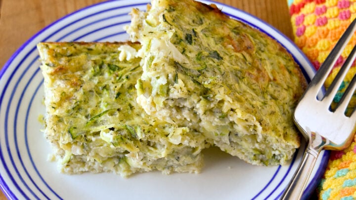 Crustless Zucchini and Cheese Pie has 2 kinds of cheese and bakes up in no time. It’s packed with fresh summer zucchini and makes a great appetizer or light lunch. #FarmersMarketWeek #zucchinirecipe