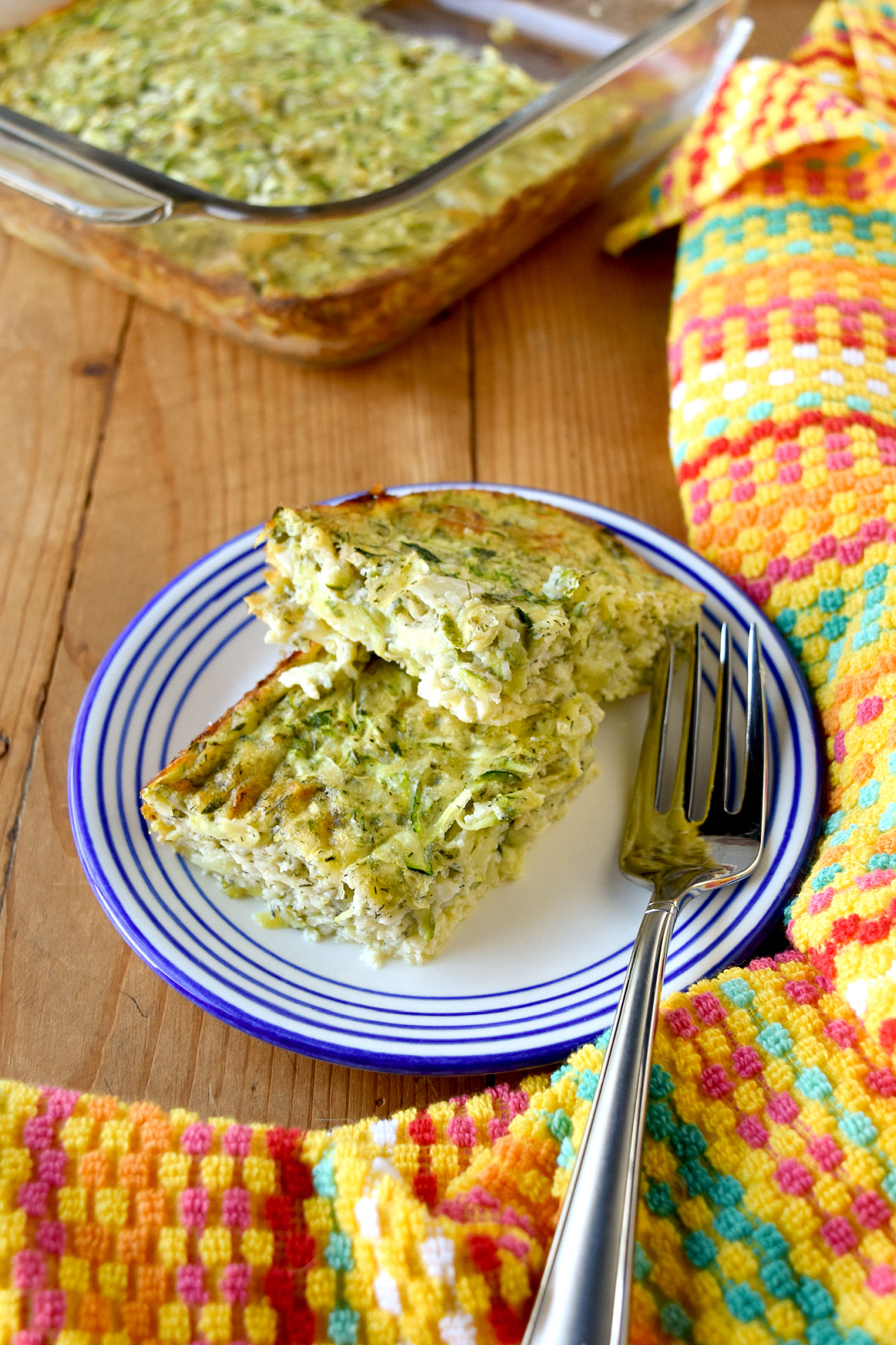 Crustless Zucchini and Cheese Pie has 2 kinds of cheese and bakes up in no time. It’s packed with fresh summer zucchini and makes a great appetizer or light lunch. #FarmersMarketWeek #zucchinirecipe #cheesepie