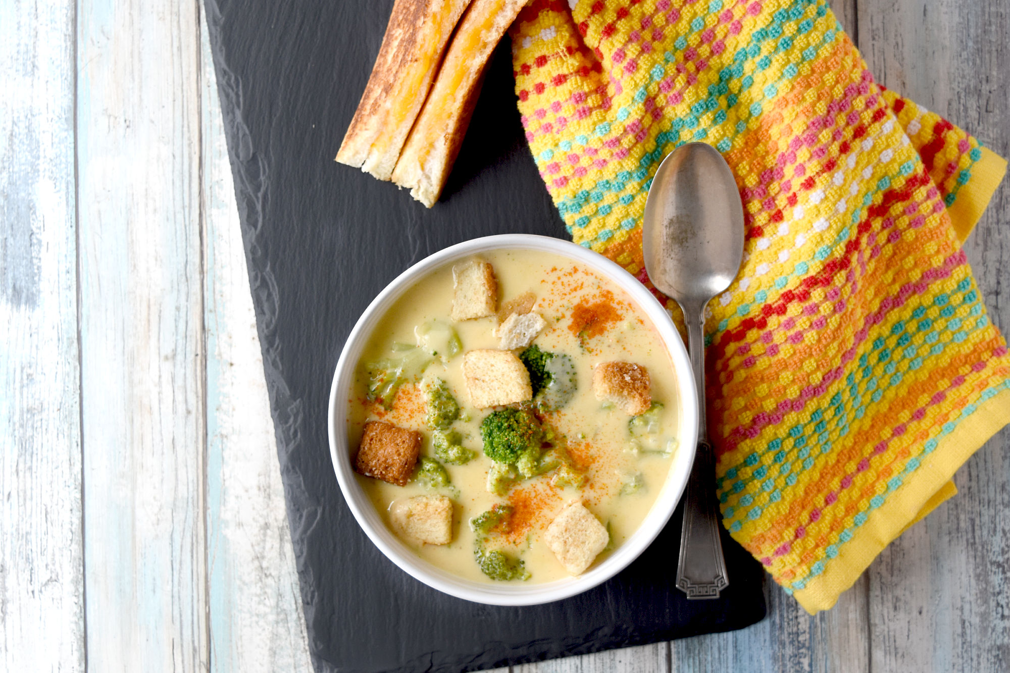 Easy Broccoli Cheese Soup cooks up quickly and tastes super delicious.  It’s fast enough for a quick lunch or easy dinner with a sandwich and delicious enough to make you lick the bowl clean.  #FallFlavors #broccolicheesesoup #easysoup #cheesesoup #extracheesy
