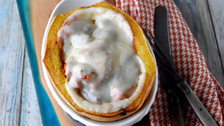 Chicken Parm Stuffed Spaghetti Squash is a light but hearty dinner. It’s light because it’s made with chicken breast and squash, but hearty because they are both very filling! #FallFlavors #spaghettisquash #ChickenParm