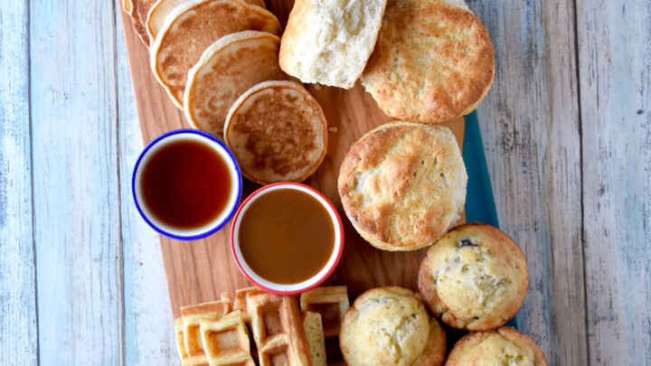 Easy Breakfast Board is simple and has all the family favorites on there. Using a pancake mix for both the pancakes and the waffles is an added bonus! #OurFamilyTable #breakfastboard #pancakes #waffles #fluffybiscuits