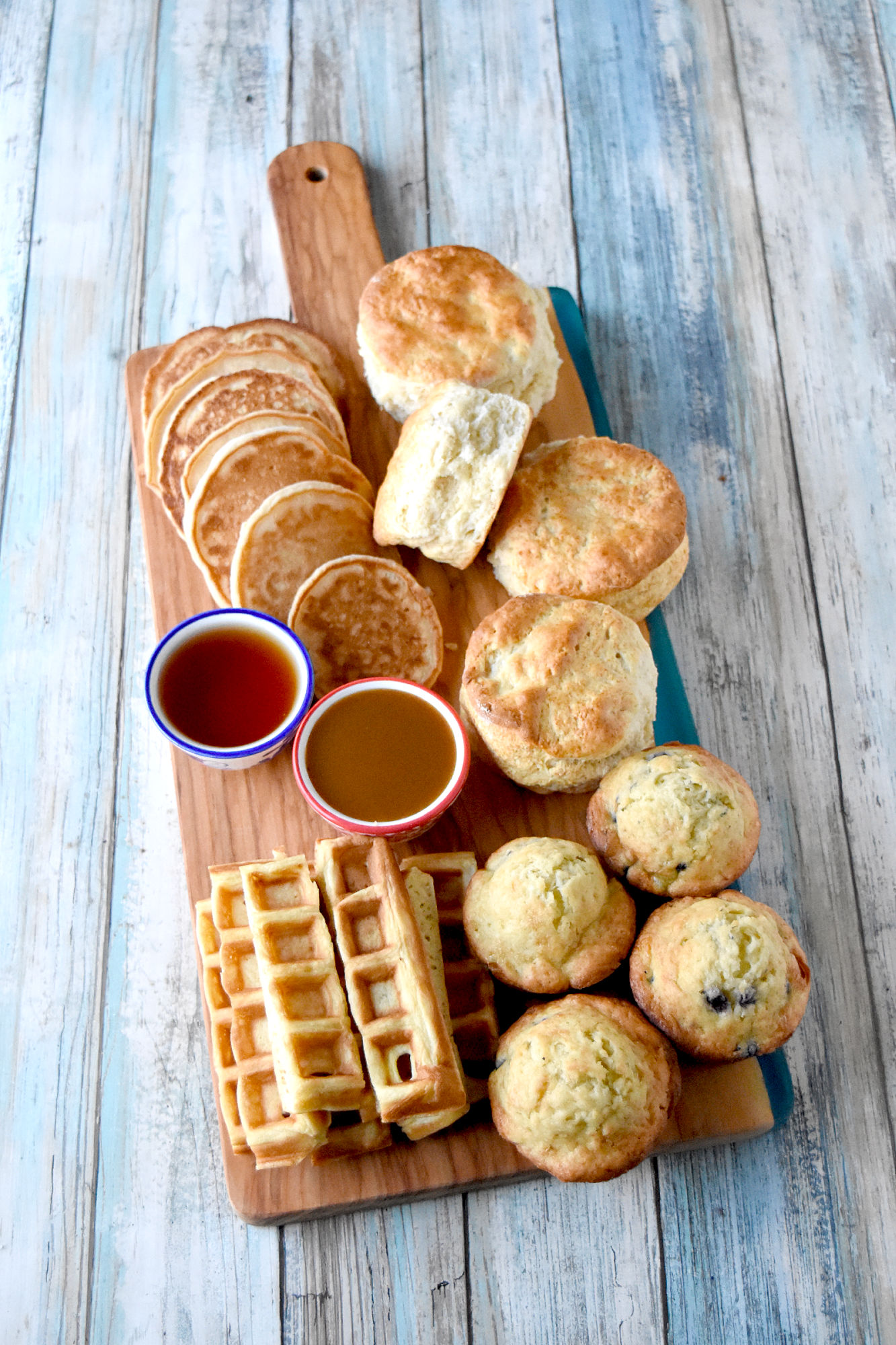 Easy Breakfast Board is simple and has all the family favorites on there. Using a pancake mix for both the pancakes and the waffles is an added bonus! #OurFamilyTable #breakfastboard #pancakes #waffles #fluffybiscuits