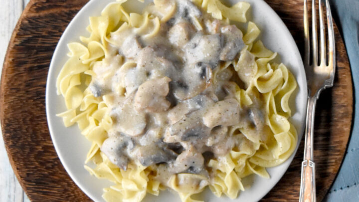 Easy Chicken Stroganoff is inspired by a dish I ate in Bosnia. It's a delicious recipe your family will love. And you'll love how easy it is to make! #OurFamilyTable #chickenrecipe #easyrecipe #comfortfood #EasyChickenStroganoff #OnePotDinners #QuickandEasyRecipes #ComfortFoodCravings #30MinuteMeals
