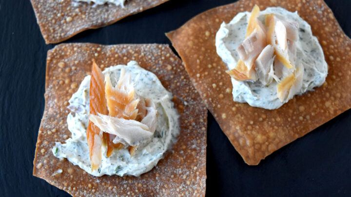 Smoked Trout Wonton Crisps are easy to prepare and a deliciously skinny appetizer for the holidays. Made with reduced fat Neufchatel cheese and tons of flavor, your guests won’t even know these are skinny appetizers. #OurFamilyTable #smokedfish #wontoncrisps #easyappetizer #skinnyappetizer
