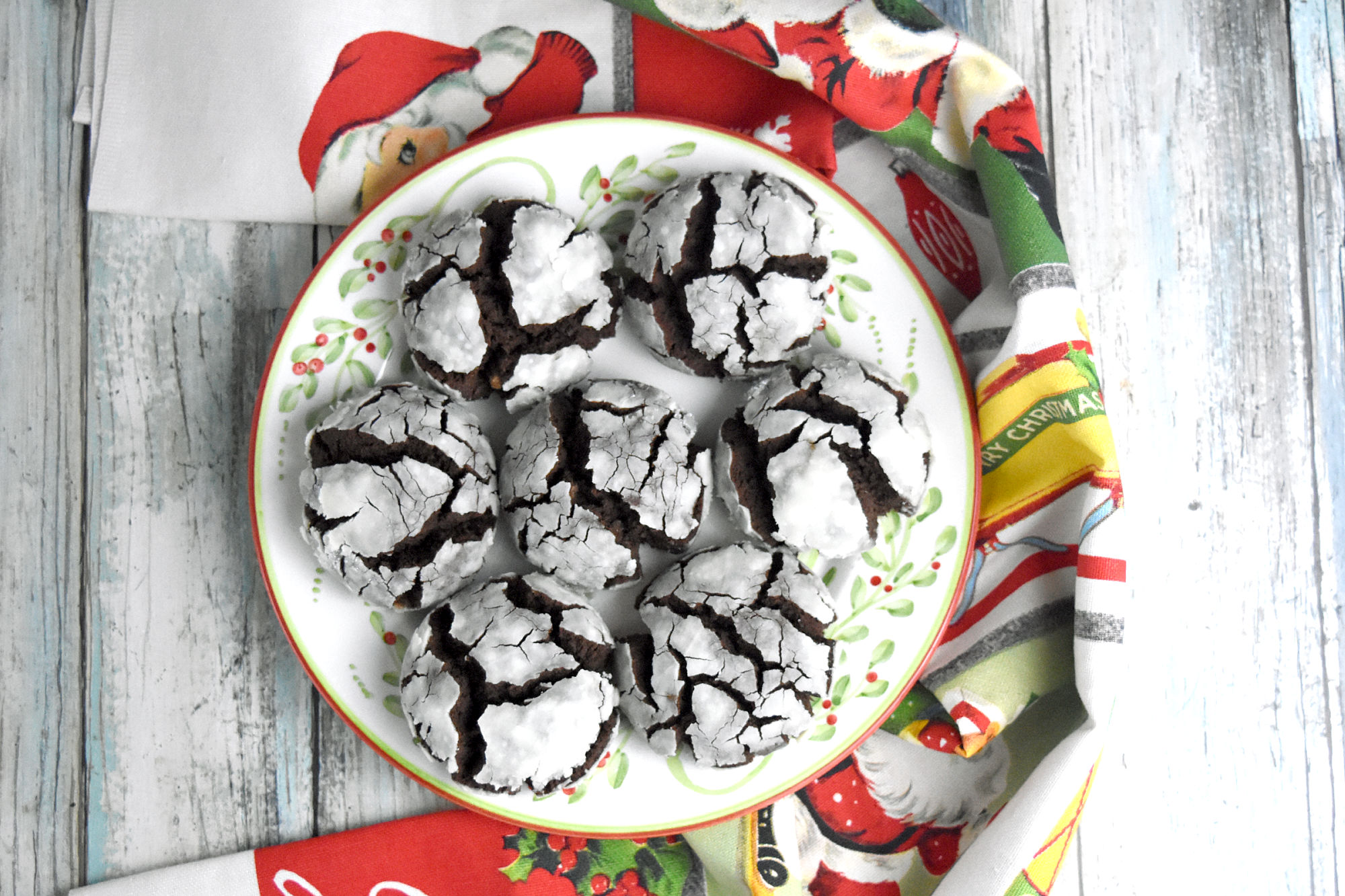 Chocolate Gingerbread Crinkle Cookies are the best of both chocolate and gingerbread crinkle cookies in one. They’re rich with chocolate with the surprise of homemade gingerbread spice. #OurFamilyTable #crinklecookies #chocolatecrinkles #gingerbreadcookies