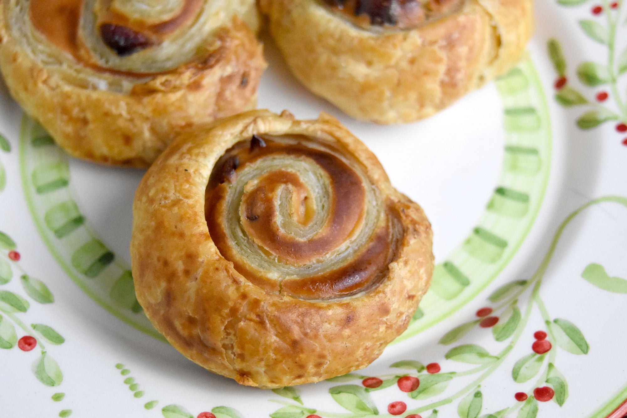 Cranberry Cream Cheese Pinwheels are super simple to make but they taste oh so delicious. With just a few ingredients, and some leftover cranberry sauce, you can have a fun and tasty appetizer. #CranberryWeek #cranberry #puffpastry #cranberrysauce #easyrecipe