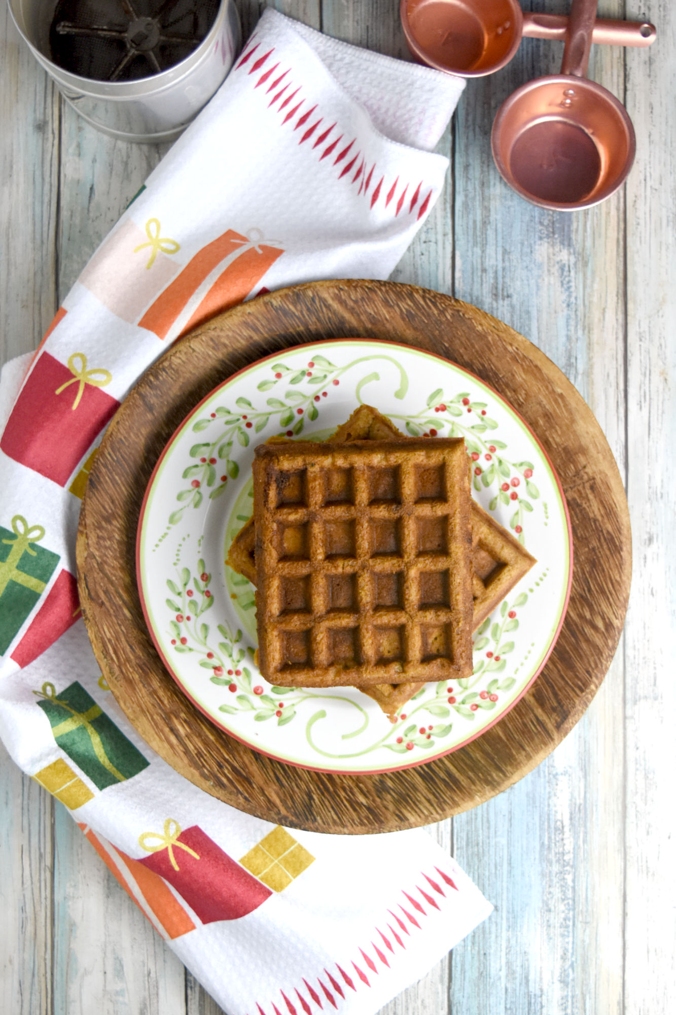 Gingerbread Waffles have all the gingerbread flavor in a delicious and easy waffle form. The spices are warming and delicious and the waffles whip up in minutes. Perfect for a holiday brunch. #ChristmasSweetsWeek #waffle #gingerbread #gingerbreadwaffles #easy #brunch