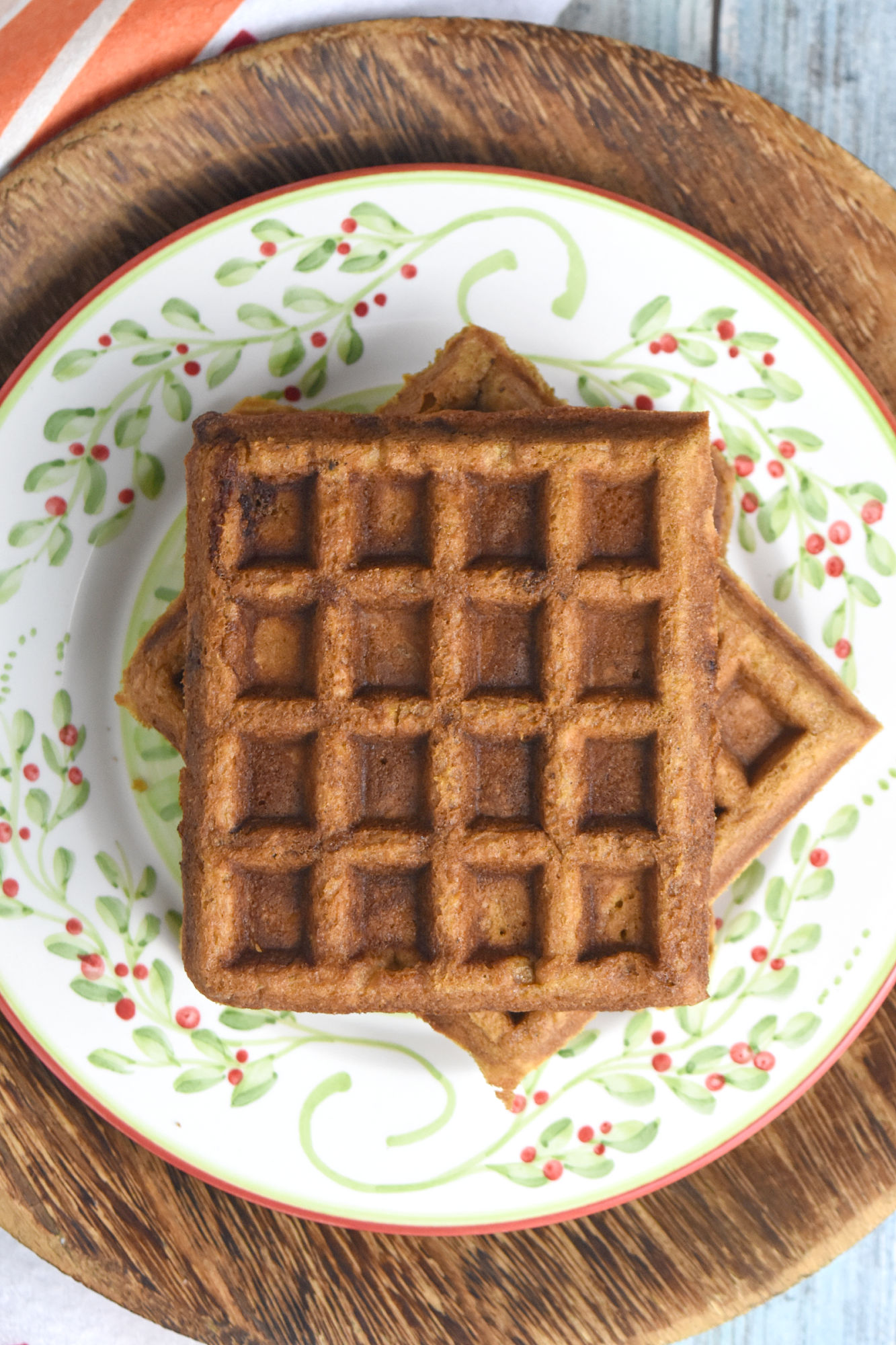 Gingerbread Waffles have all the gingerbread flavor in a delicious and easy waffle form. The spices are warming and delicious and the waffles whip up in minutes. Perfect for a holiday brunch. #ChristmasSweetsWeek #waffle #gingerbread #gingerbreadwaffles #easy #brunch