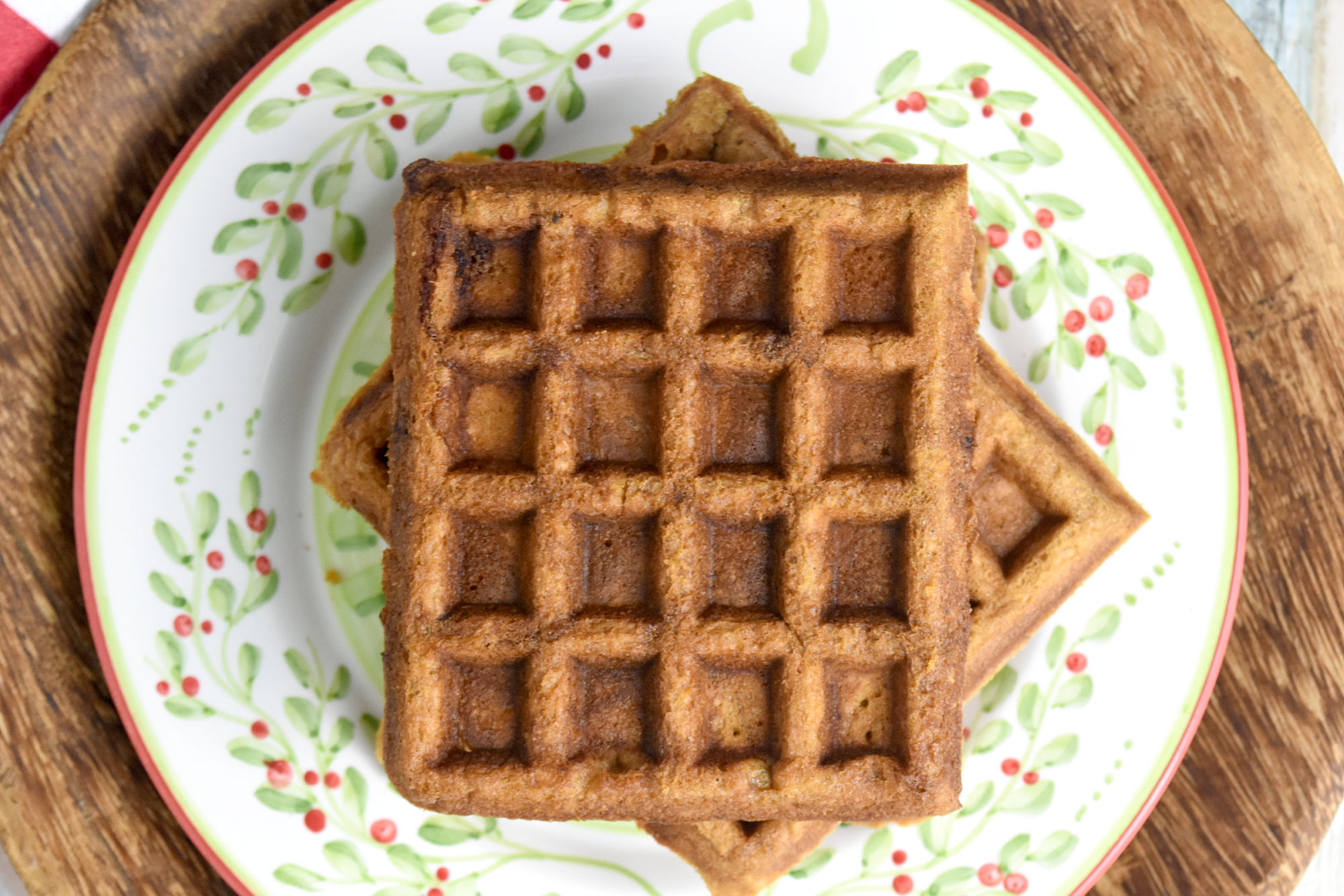 Gingerbread Waffles have all the gingerbread flavor in a delicious and easy waffle form. The spices are warming and delicious and the waffles whip up in minutes. Perfect for a holiday brunch. #ChristmasSweetsWeek #waffle #gingerbread #gingerbreadwaffles #easy #brunch