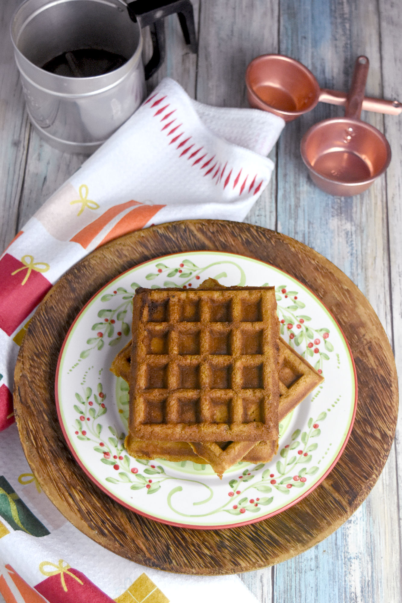 Gingerbread Waffles have all the gingerbread flavor in a delicious and easy waffle form. The spices are warming and delicious and the waffles whip up in minutes. Perfect for a holiday brunch. #ChristmasSweetsWeek #waffle #gingerbread #gingerbreadwaffles #easy #brunch