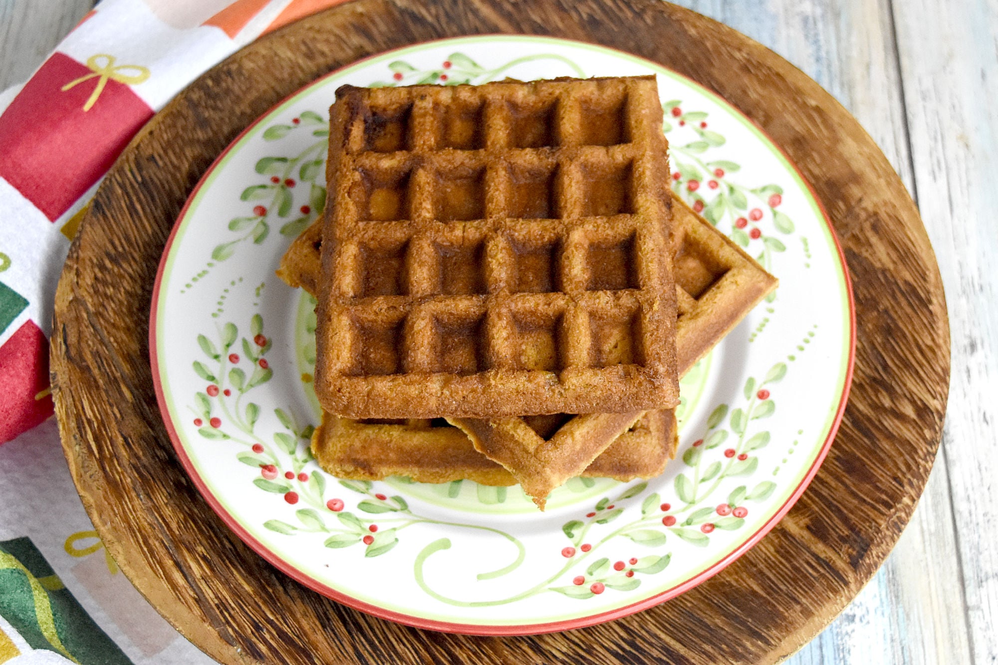 Gingerbread Waffles have all the gingerbread flavor in a delicious and easy waffle form. The spices are warming and delicious and the waffles whip up in minutes. Perfect for a holiday brunch. #ChristmasSweetsWeek #waffle #gingerbread #gingerbreadwaffles #easy #brunch